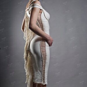 Body contour white cotton sexy dress with fringe and cutouts.